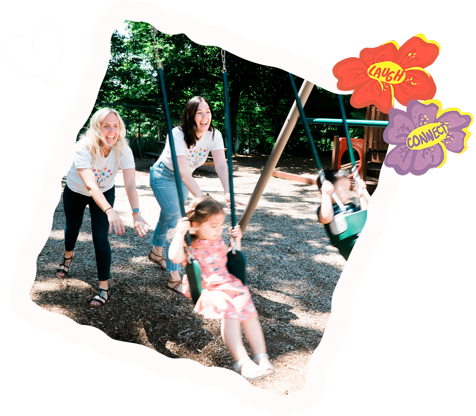 Tara & Lisa pushing kids on swings
