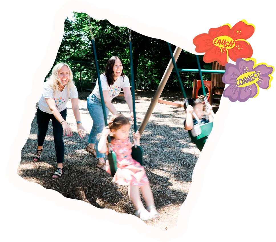 Tara & Lisa pushing kids on swings